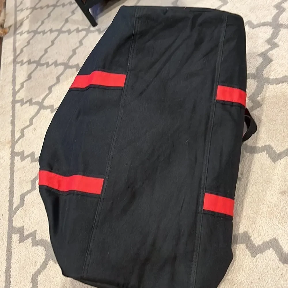 True Religion Black and Red Strap Duffel Bag